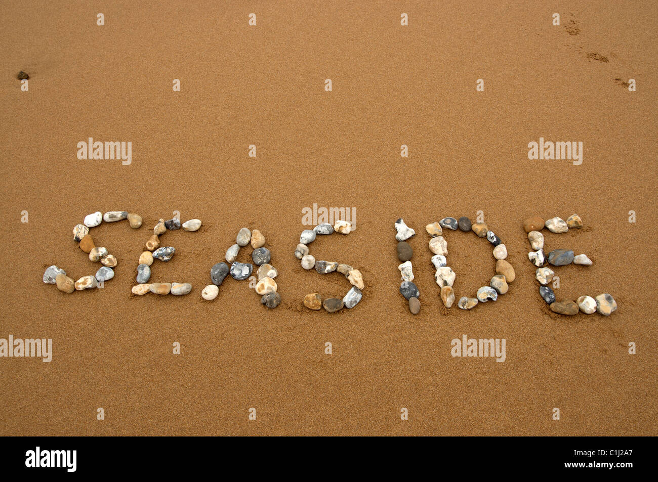 Seaside In Stone Writing Beach Sea Sand Seaside Stock Photo