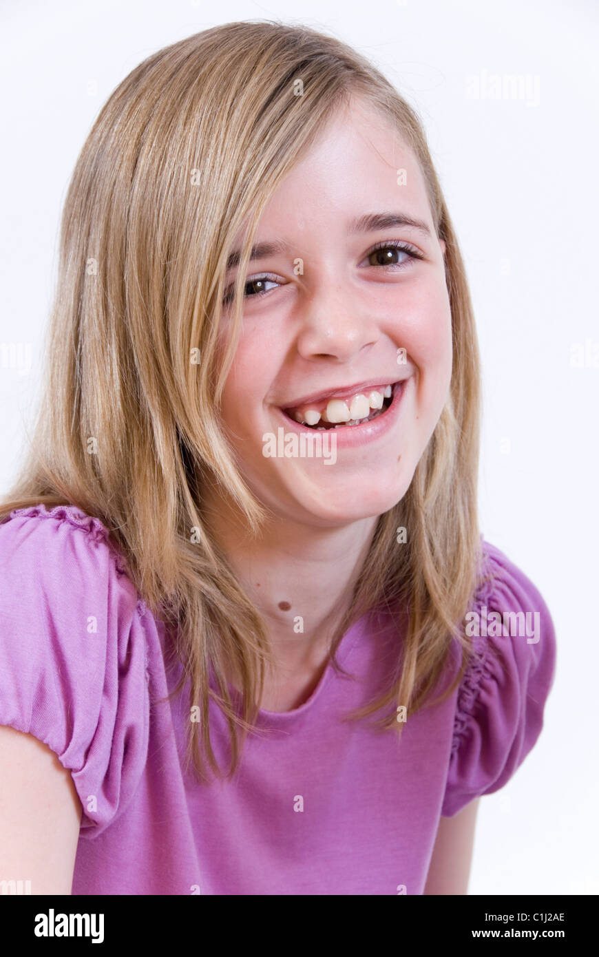 Studio Portrait of a Smiling Young Girl with Blonde Hair, Isolated on ...