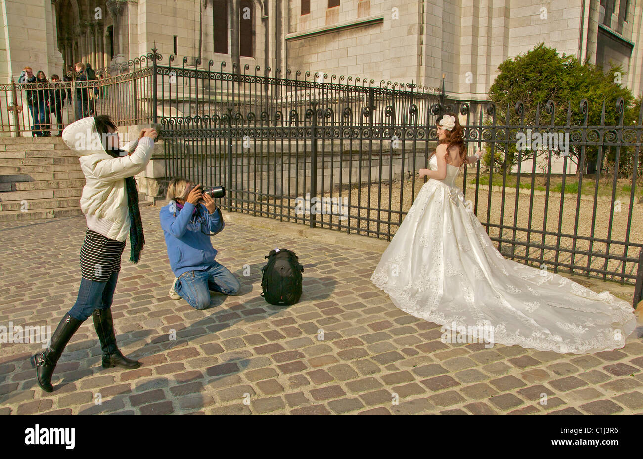 A bride is photographed outside a church in Paris. Stock Photo