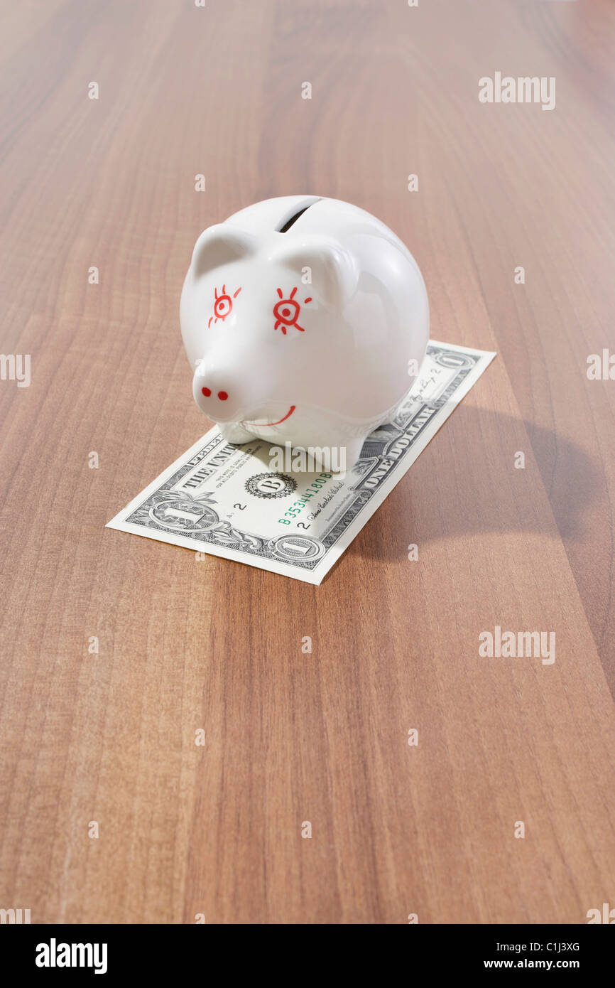 Piggy Bank and Dollar Bill Stock Photo Alamy