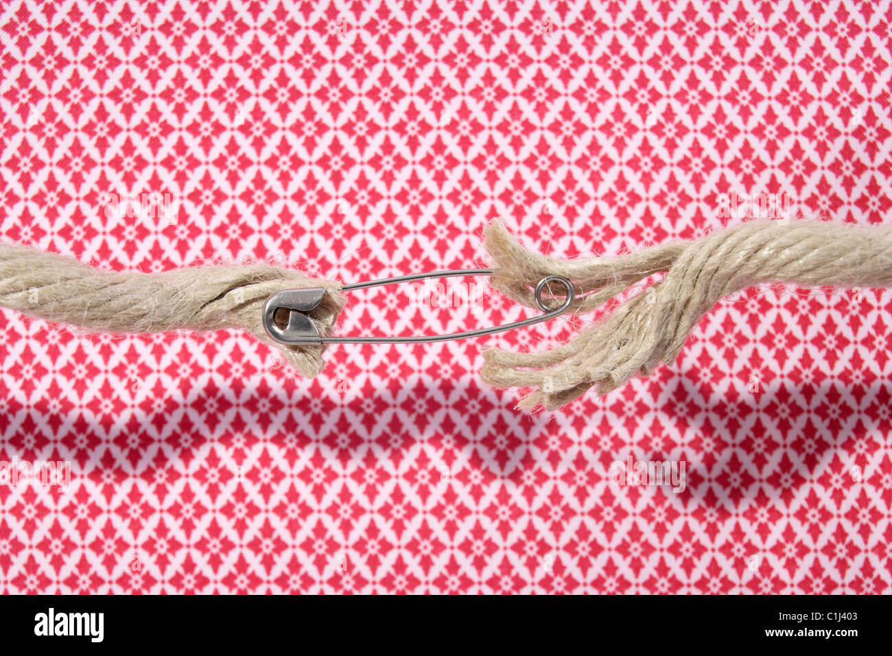 Ropes Held Together with Safety Pin Stock Photo Alamy