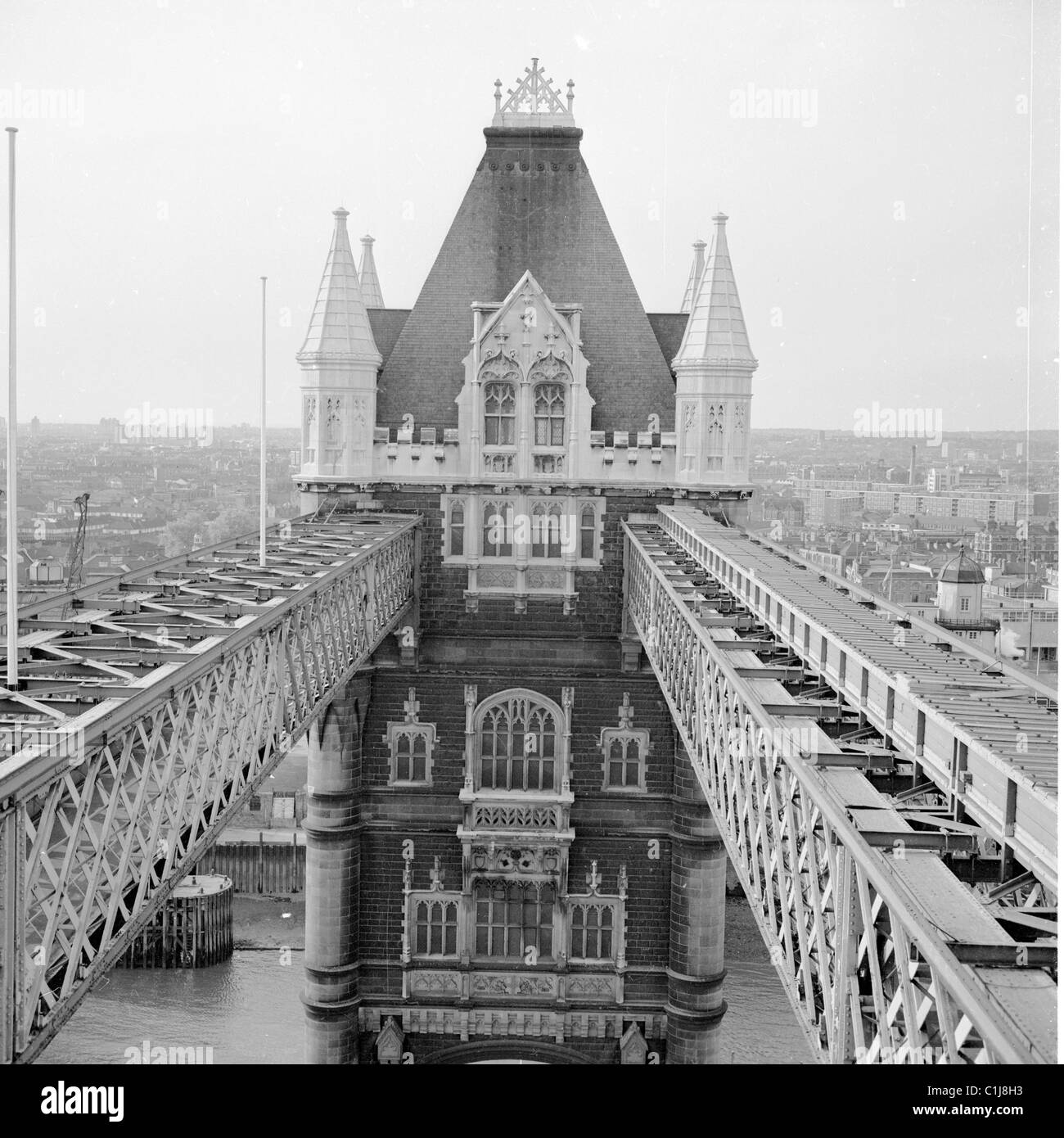 1950s, top of Tower Bridge over the River Thames, London, showing the two horizontal walkways connecting to one of the bridge's two gothic towers. Stock Photo