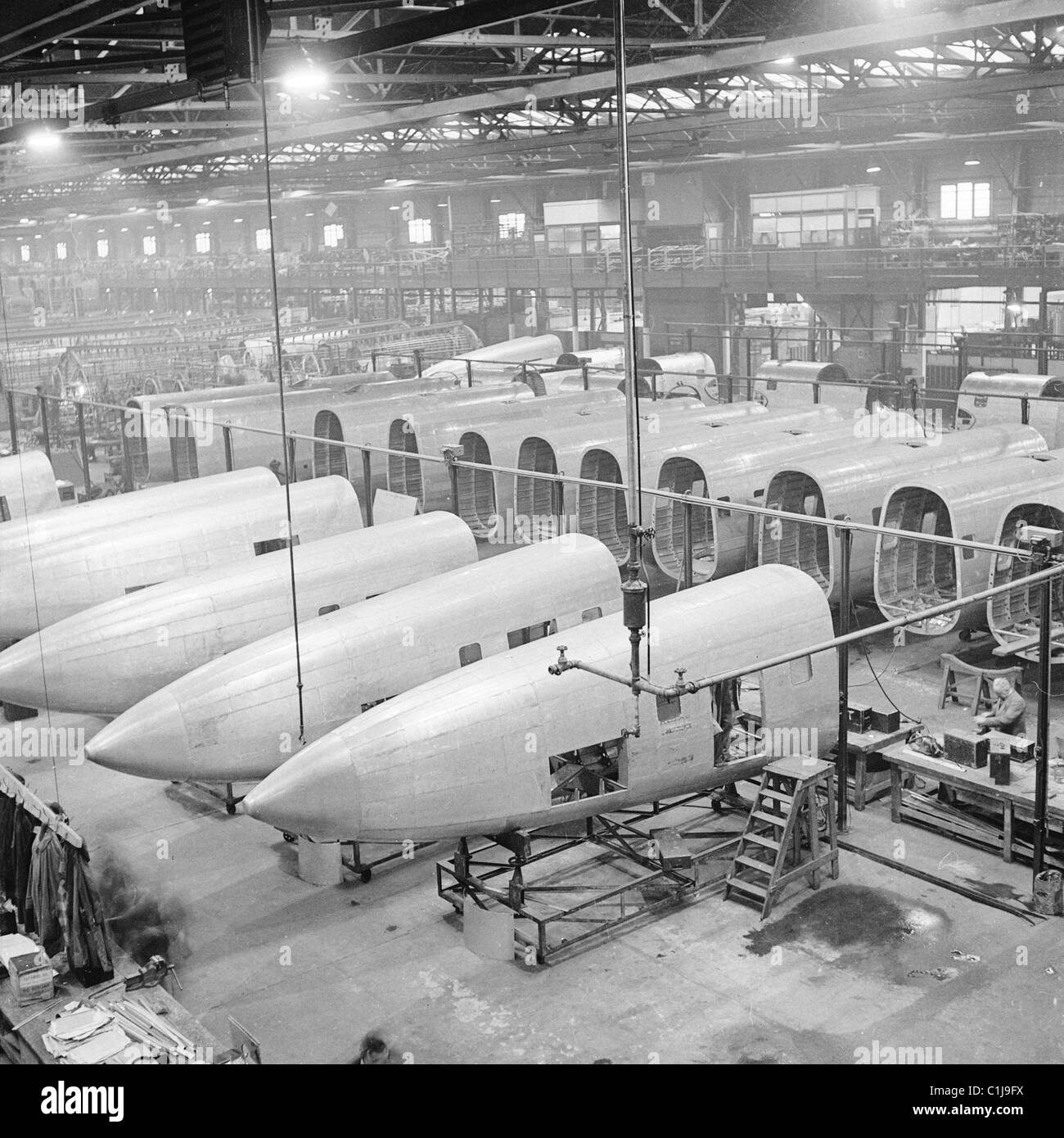 1940s, civilian AVRO Lancastrian aeroplanes under construction at a hangar at Yeadon Aeordrome, a conversion of the famous Lancaster bomber. Stock Photo