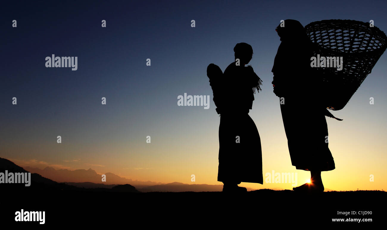 Nepali silhouettes at sunrise Nepal Himalaya Stock Photo