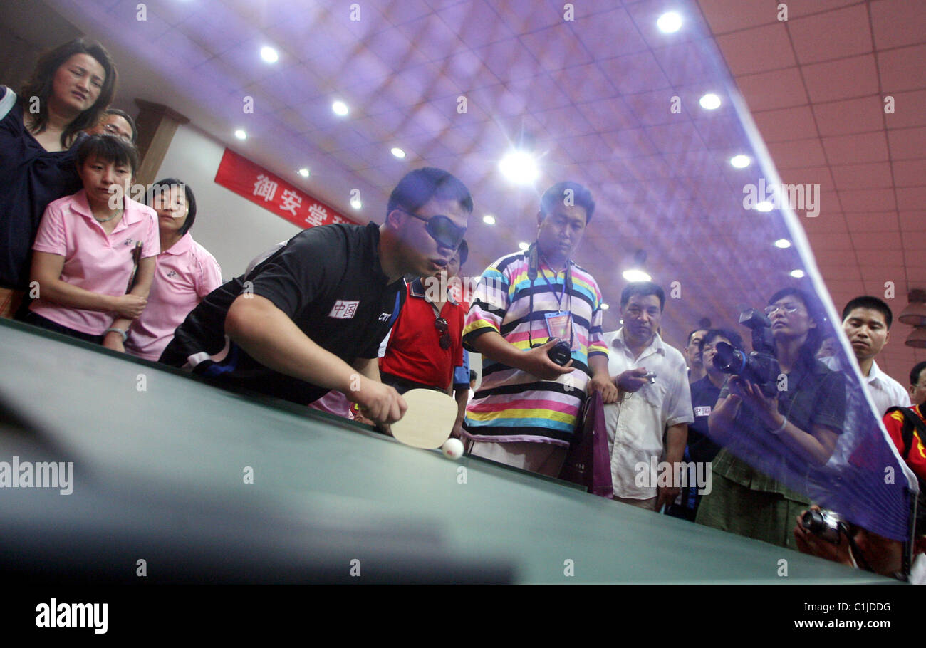Blind table tennis A blind competitor wearing an eye patch plays Table