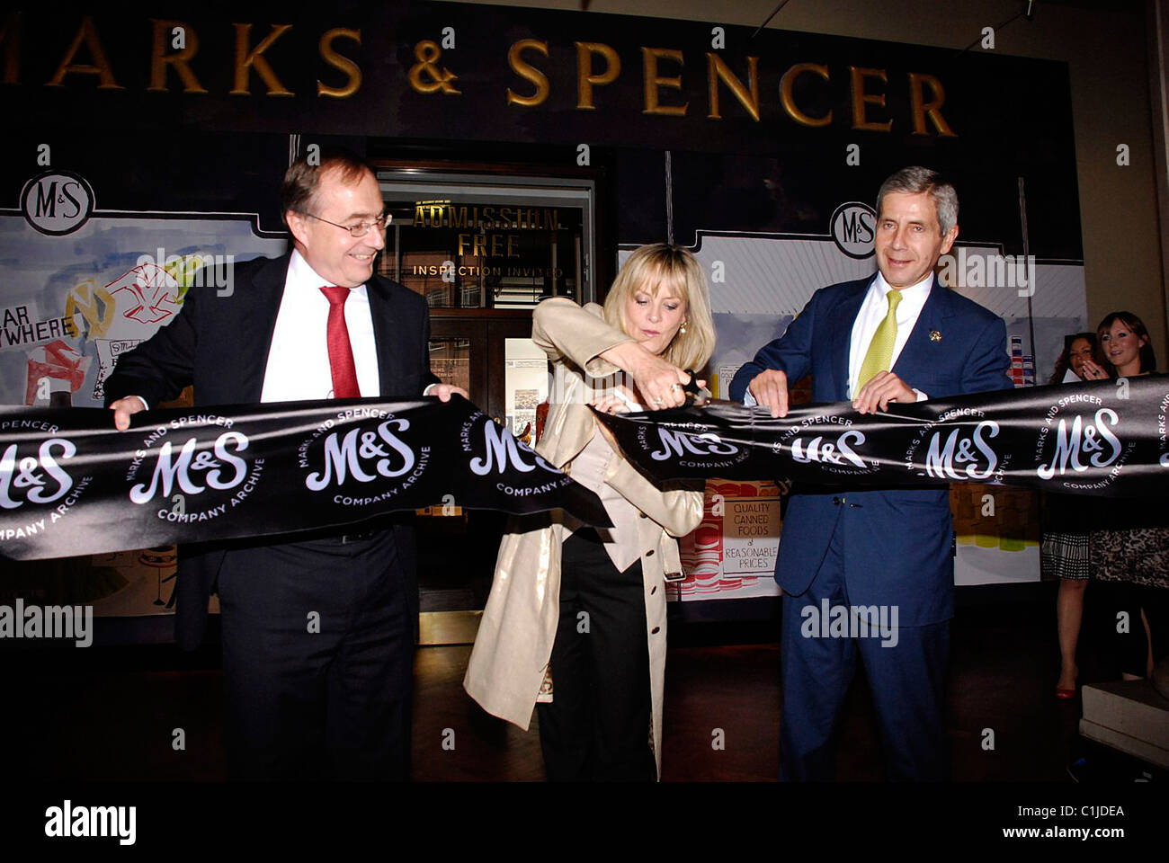 Michael Arthur, Twiggy Lawson and Sir Stuart Rose    open the doors to the Mark's & Spencer 125th birthday exhibition, 'Marks Stock Photo