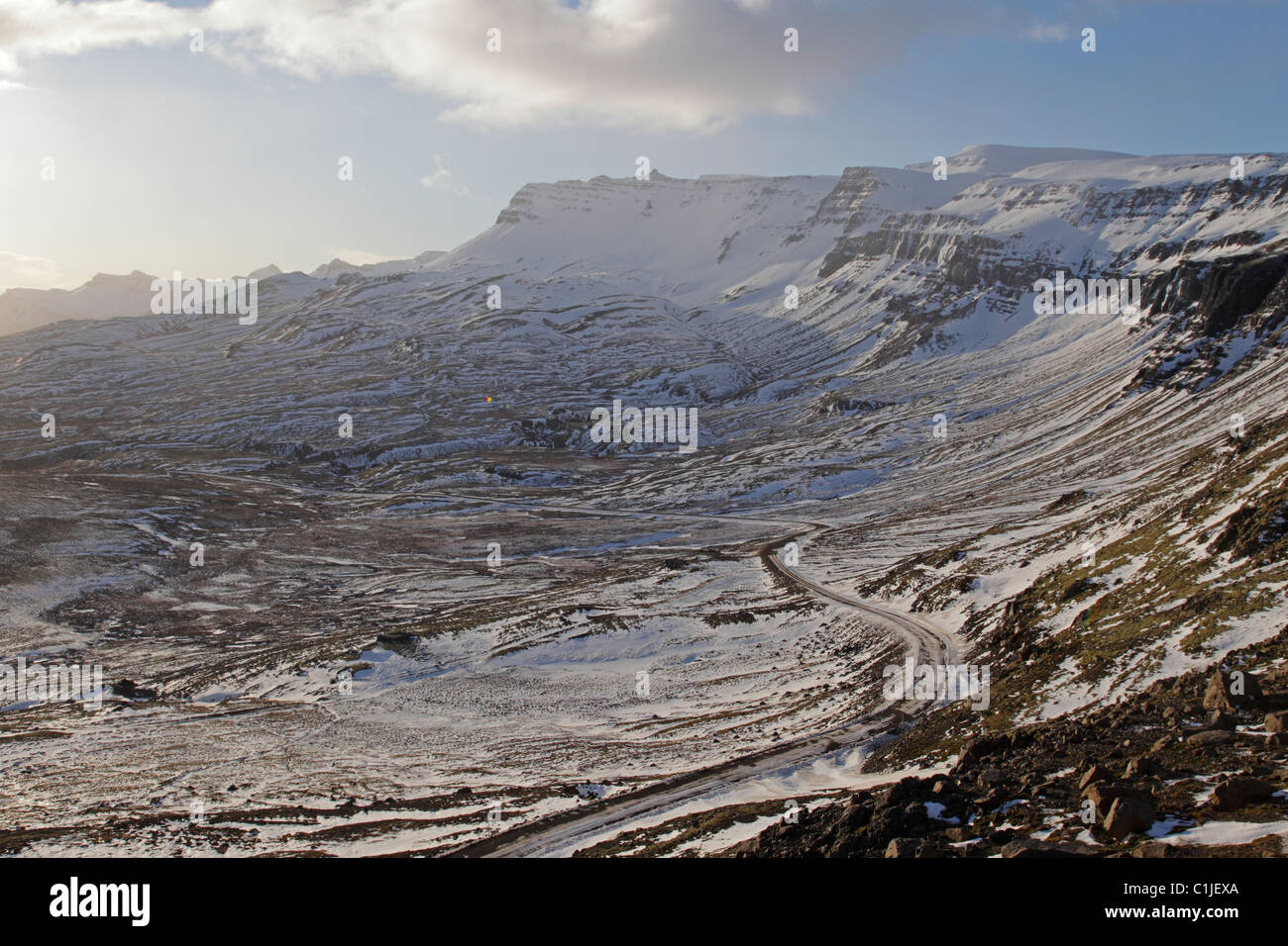 View down a snow covered valley in eastern iceland in winter showing route one Stock Photo