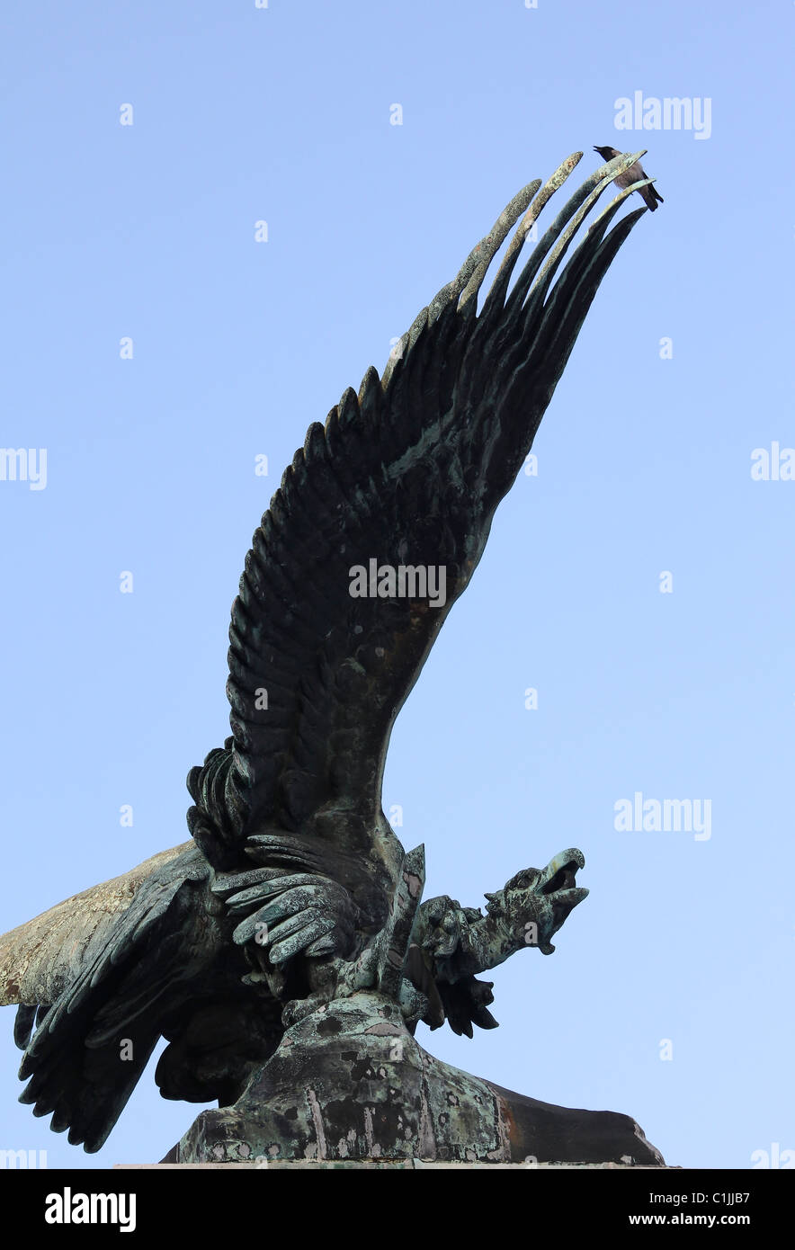 Crow's is on the wing of the turul sculpture. Stock Photo