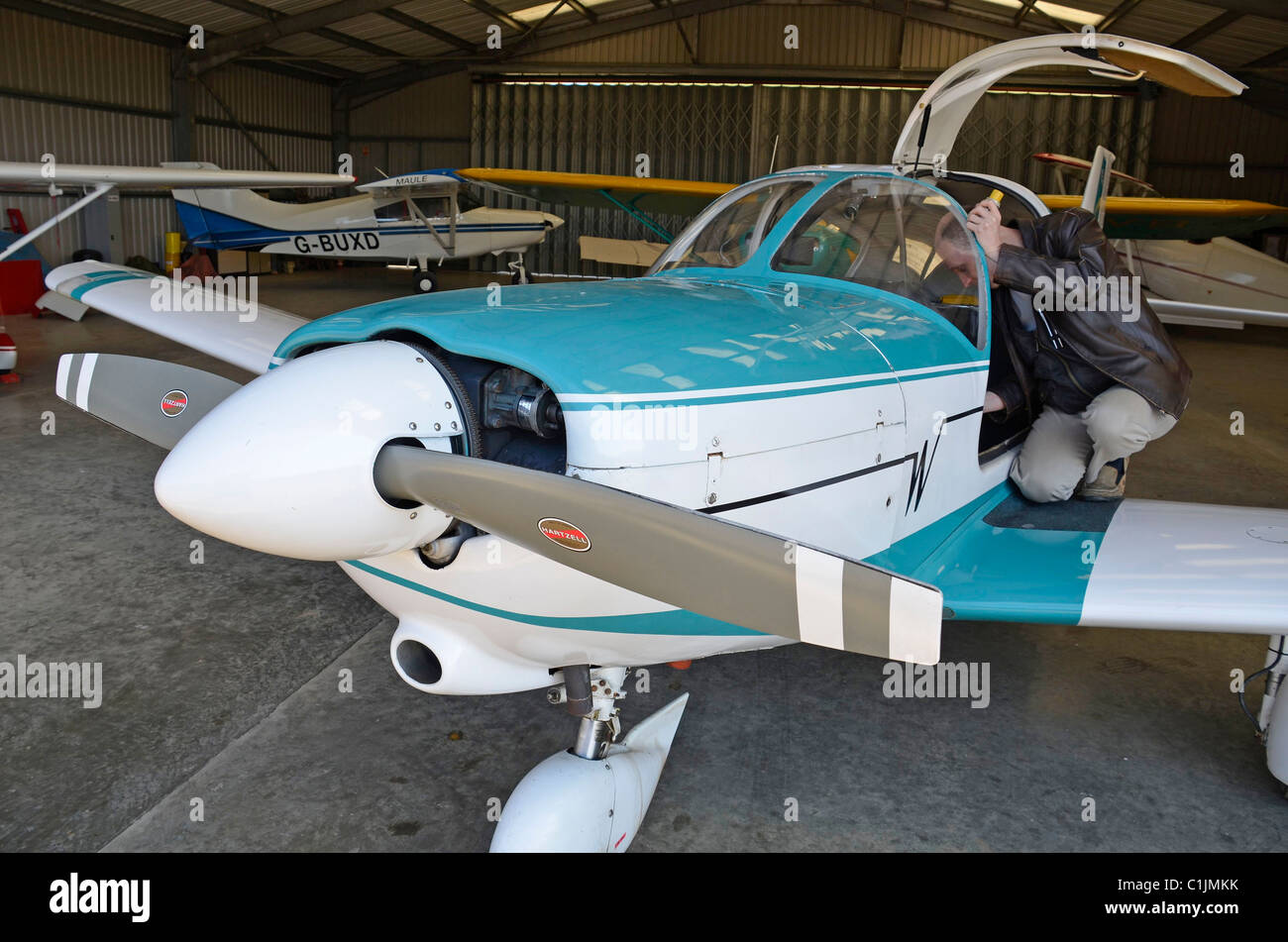 flight checks on light aircraft in hanger at popham airfield Stock Photo