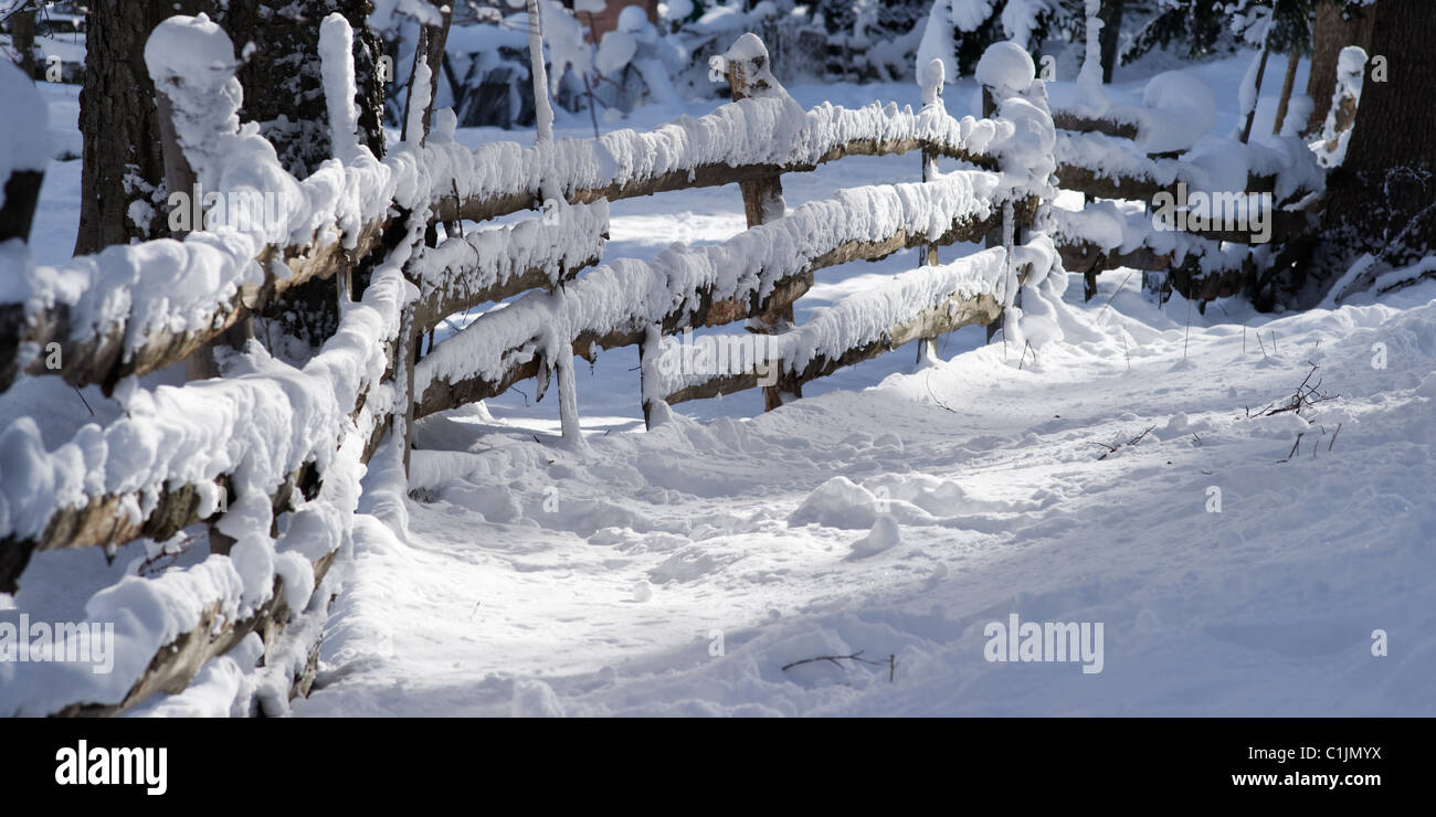 Wooden fence under snow Stock Photo - Alamy