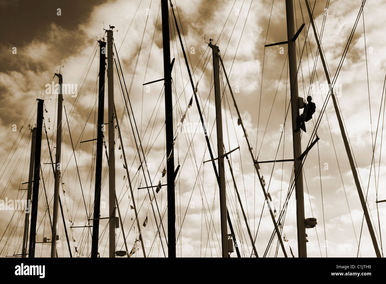 Sailor climbing yacht mast Stock Photo Alamy