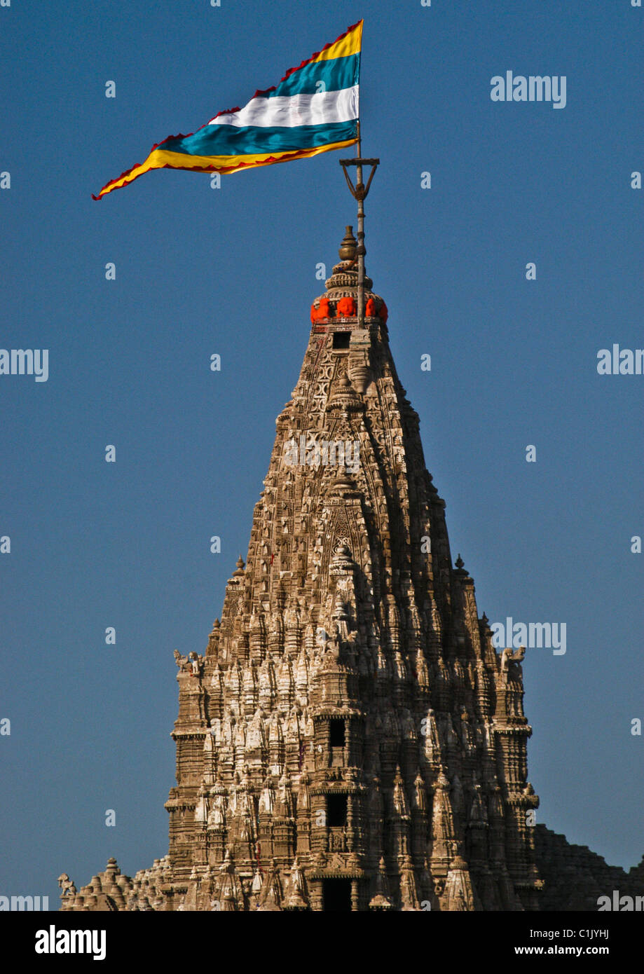 Exquisitely carved 43 meters high tower of ancient magnificent seven storied Dwarkadhish temple in Dwarka, west coast of India. Stock Photo