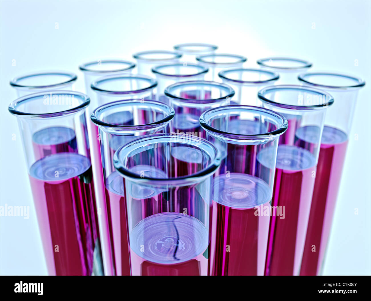 Hi-res render of sixteen test tubes containing pink fluid with shallow depth of field and light blue background. Stock Photo