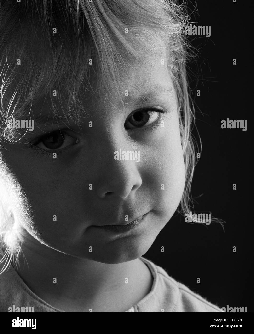 A 4 year old child with a tear on her cheek. Stock Photo