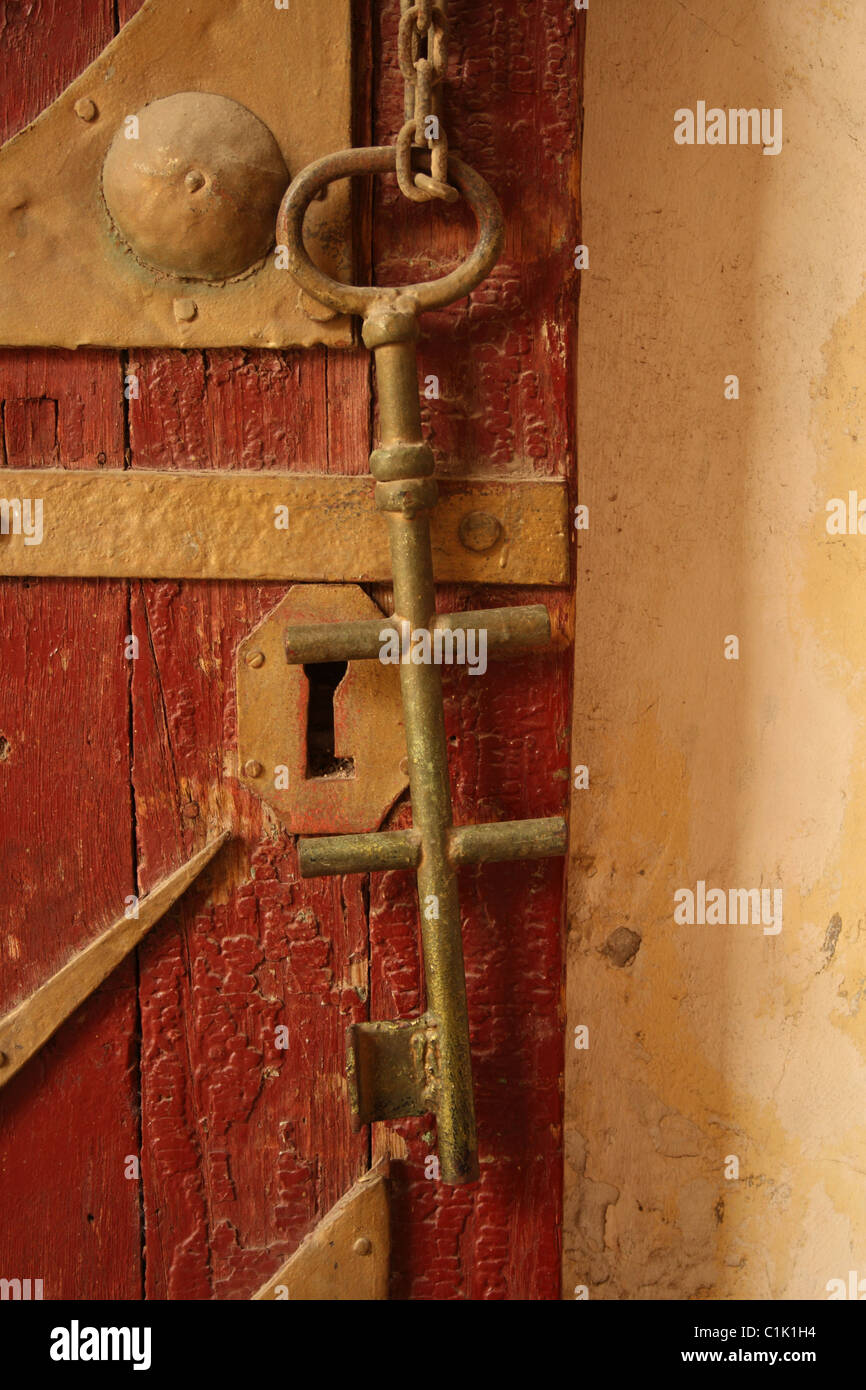 Large Old Door Key Hanging on Chain on Door at Old or Coptic Cairo