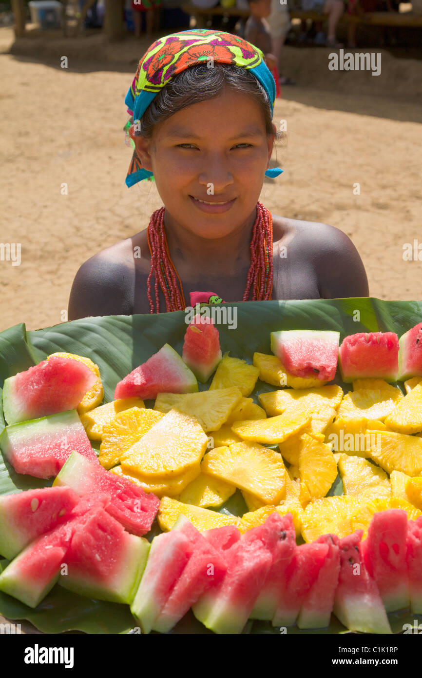 Girl of the Native Indian Embera Tribe offering fresh fruit, Embera Village, Panama Stock Photo