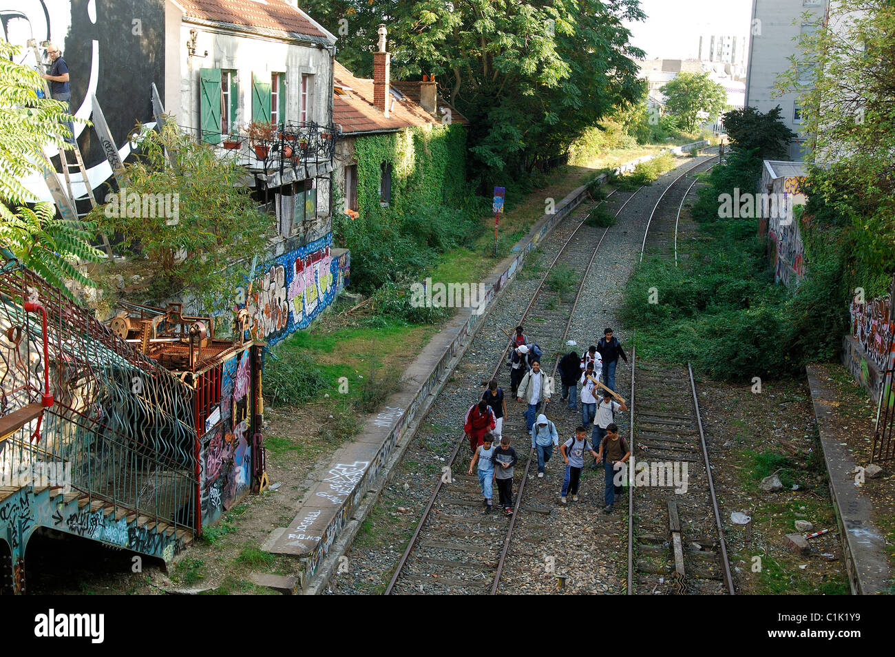 France, Paris, children on the Small Belt (golden arrow) old train line in Menilmontant Stock Photo