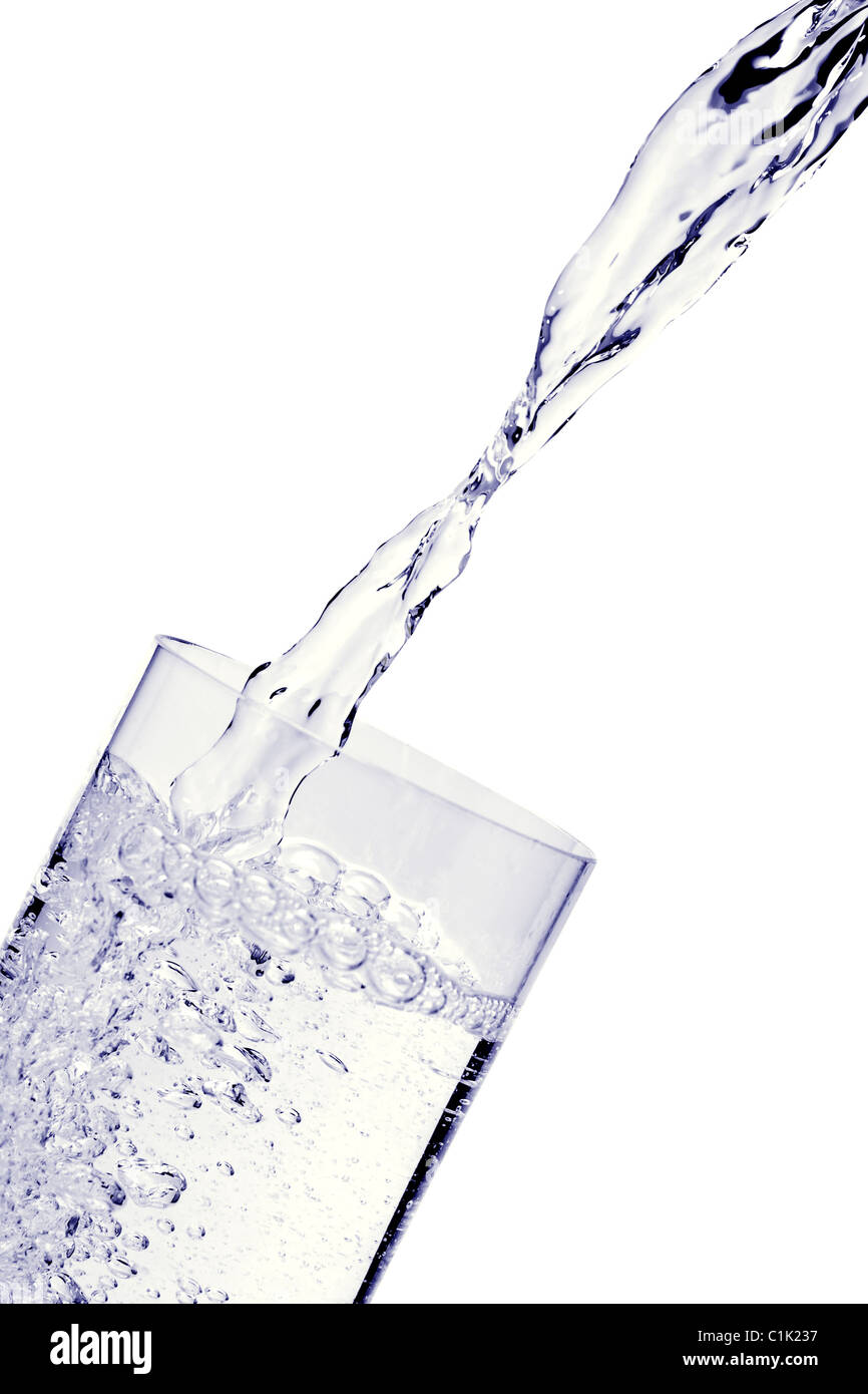 Fresh water being poured into glass isolated on white background Stock