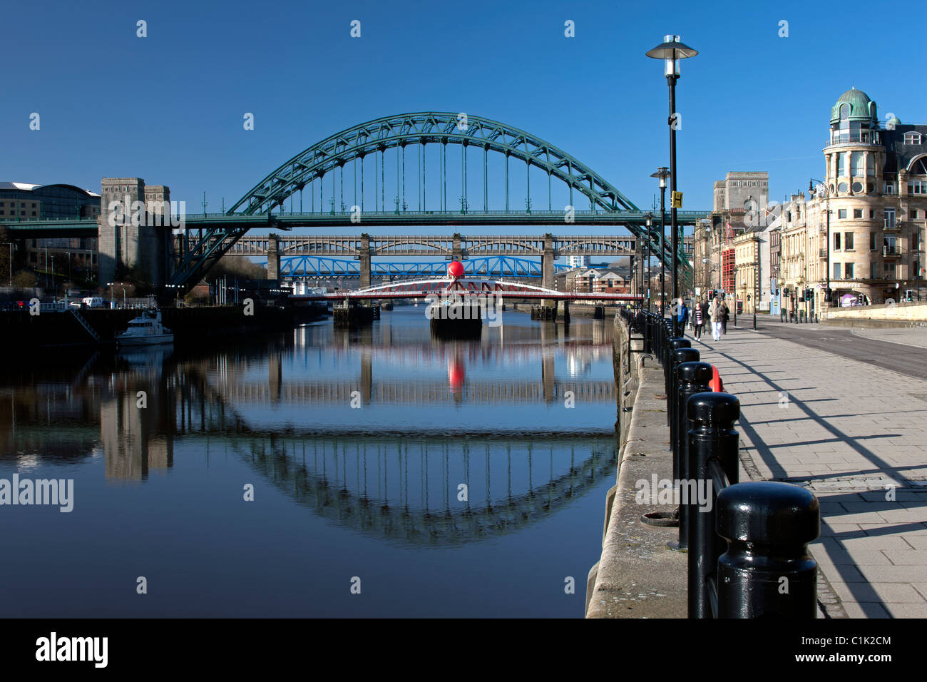 Tyne Bridges reflected on the River Tyne in early morning, looking down Newcastle Quayside to the east, Newcastle upon Tyne Stock Photo