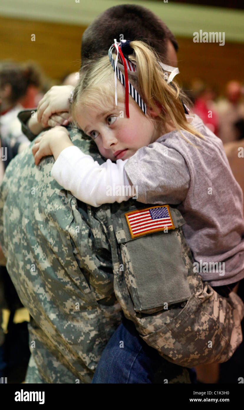 Jeff Lingenfelter holds his daughter Bella during a deployment ceremony ...