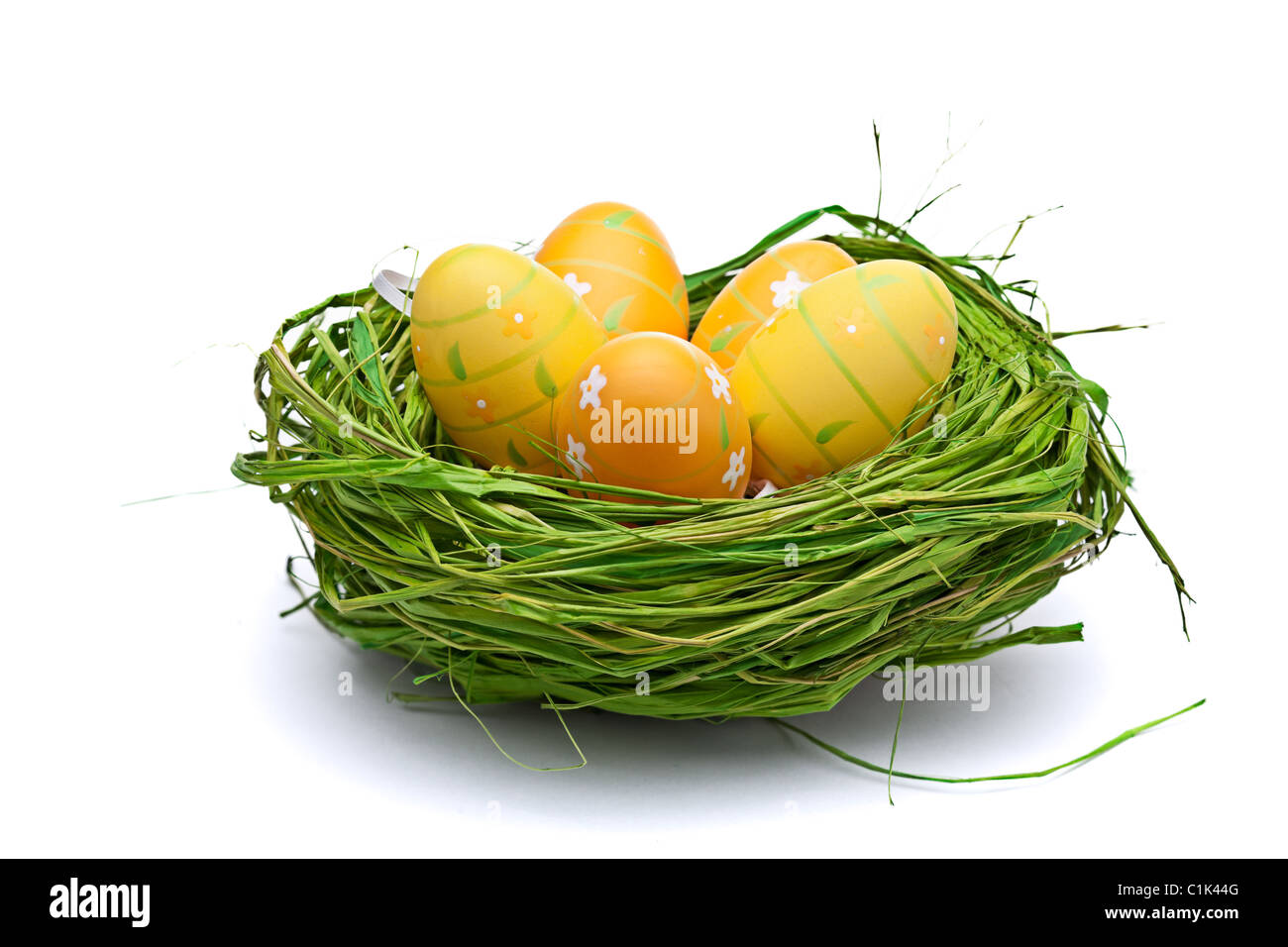 Nest full of eggs. Isolated on a white background Stock Photo - Alamy