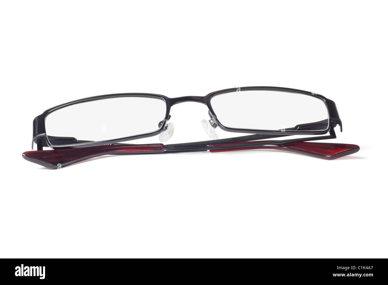 Fashionable metal frame eyeglasses on white background Stock Photo