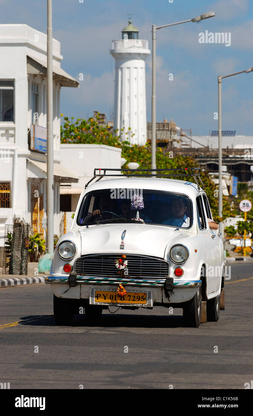 India, Pondicherry Territory, an ambassador car on Pondicherry waterfront and the lighthouse Stock Photo
