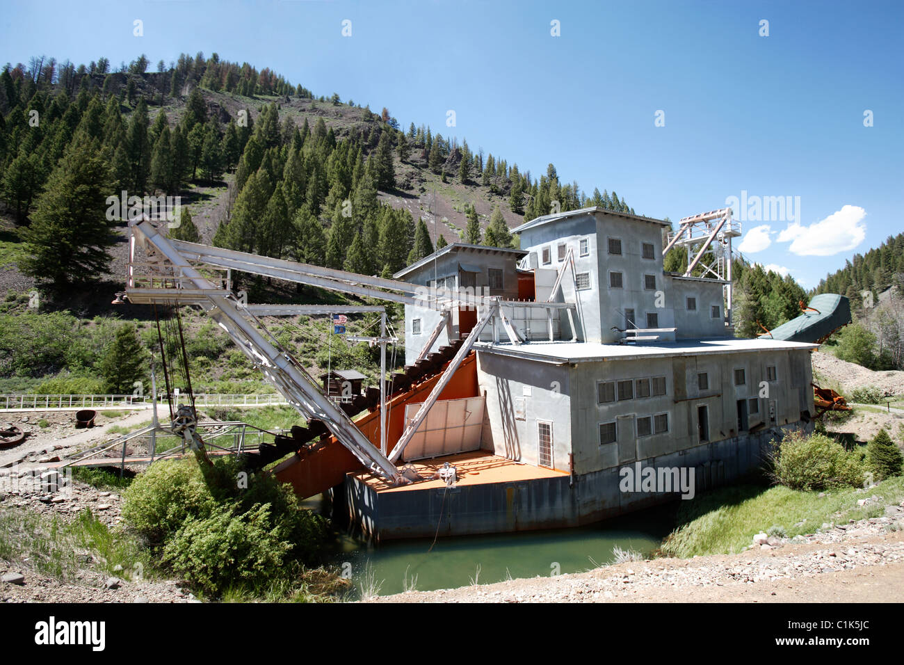 An abandoned decaying gold dredge located on the Yankee Fork of the