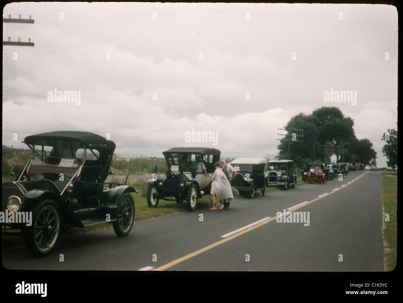 Antique cars on florida road during car show rally. lined up travel americana 1950s open road Stock Photo