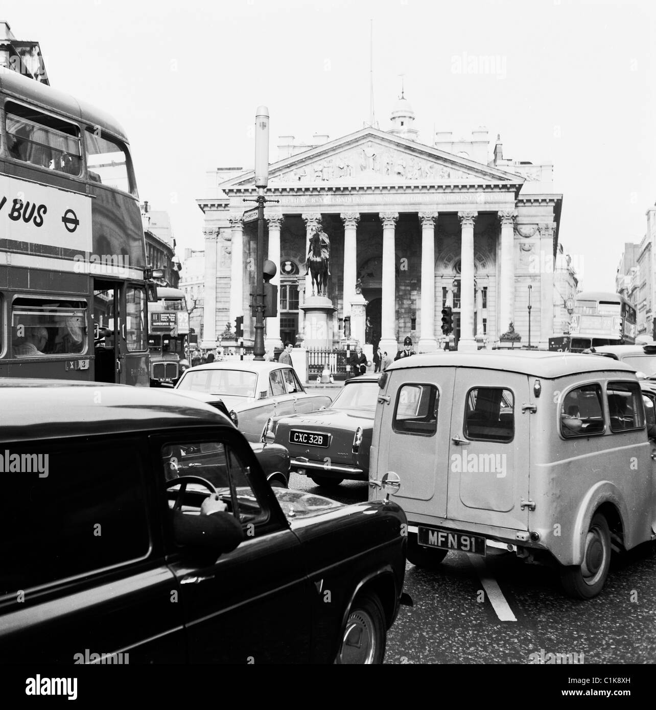 1960s, traffic congestion in the city of London at Bank, a major road junction with landmark buildings such as the Royal Exchange seen here. Stock Photo