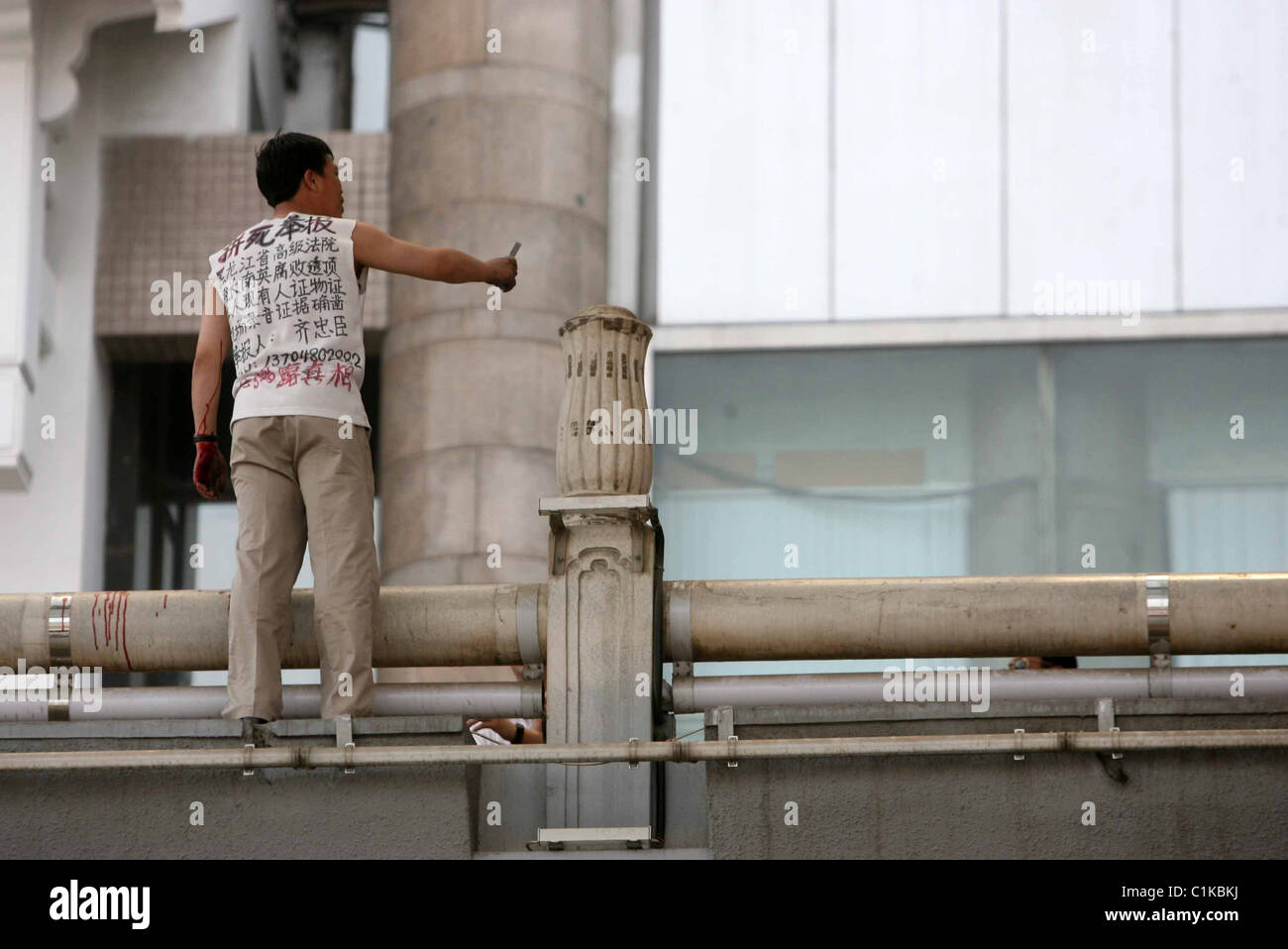 GRASS IN SUICIDE HORROR A man slashes his wrists and plunges 40ft in a
