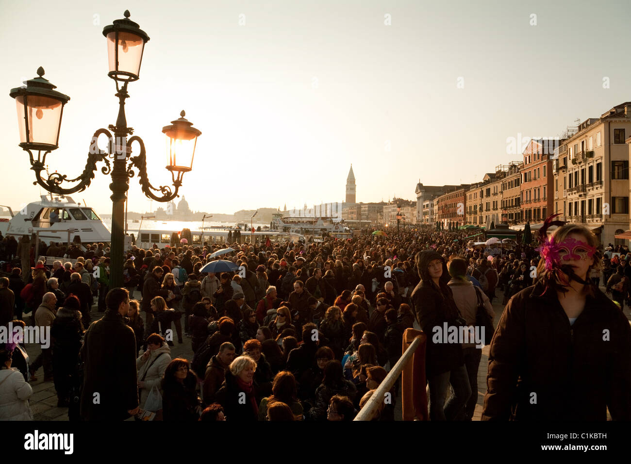 Venice crowded; Crowds at sunset, the Venice carnival, Venice, Italy Stock Photo