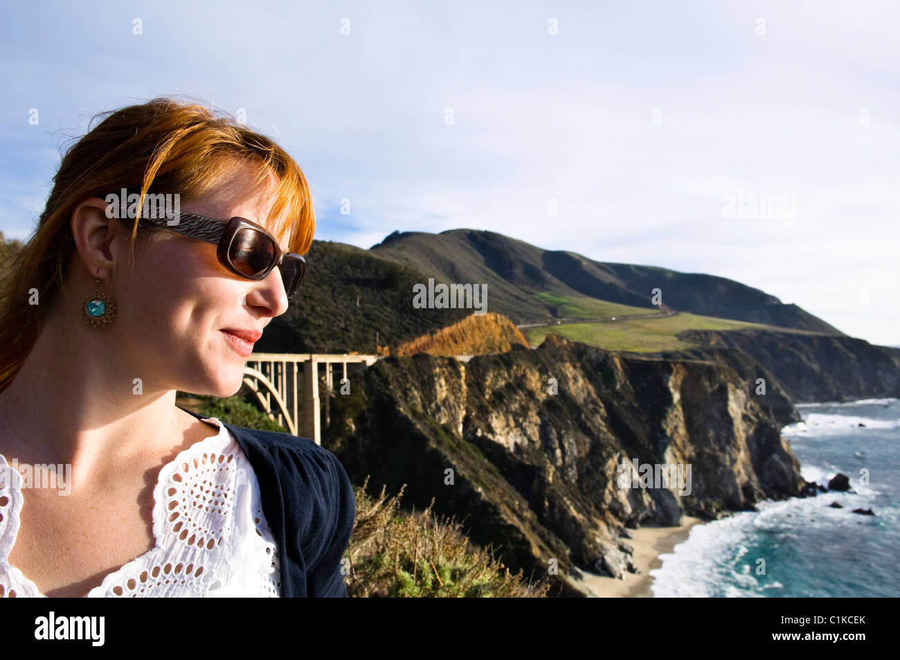 Woman Looking at View of Big Sur Coast and Santa Lucia Mountains, Monterey County, California, USA Stock Photo