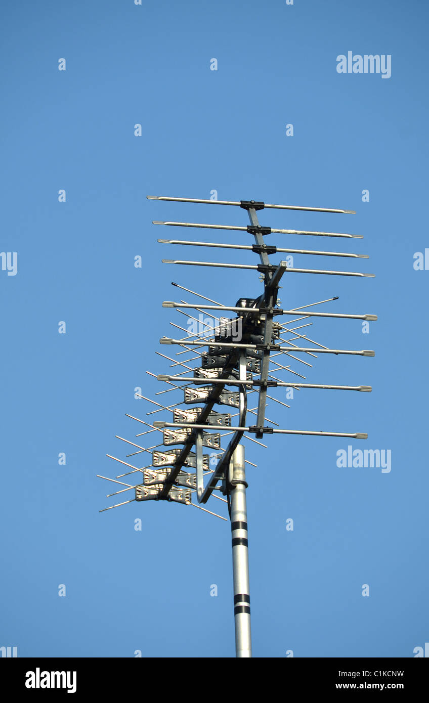 Television antenna with a blue sky background Stock Photo