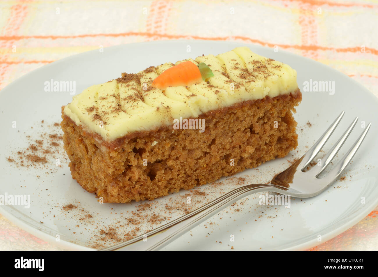 Slice of carrot cake on a white plate Stock Photo