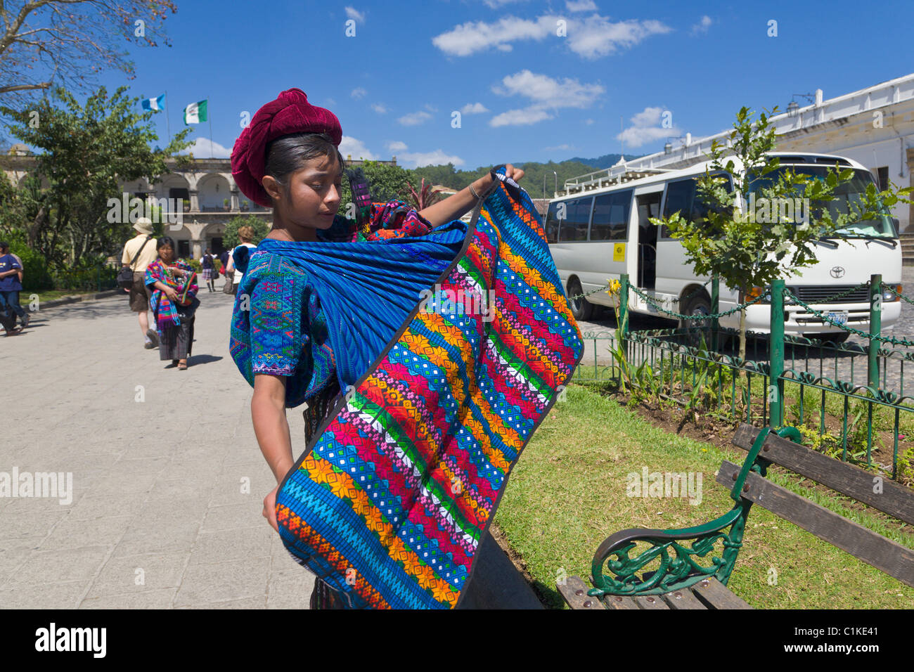 Mayan woman selling handmade textiles and souvenirs, Antigua, Guatemala Stock Photo