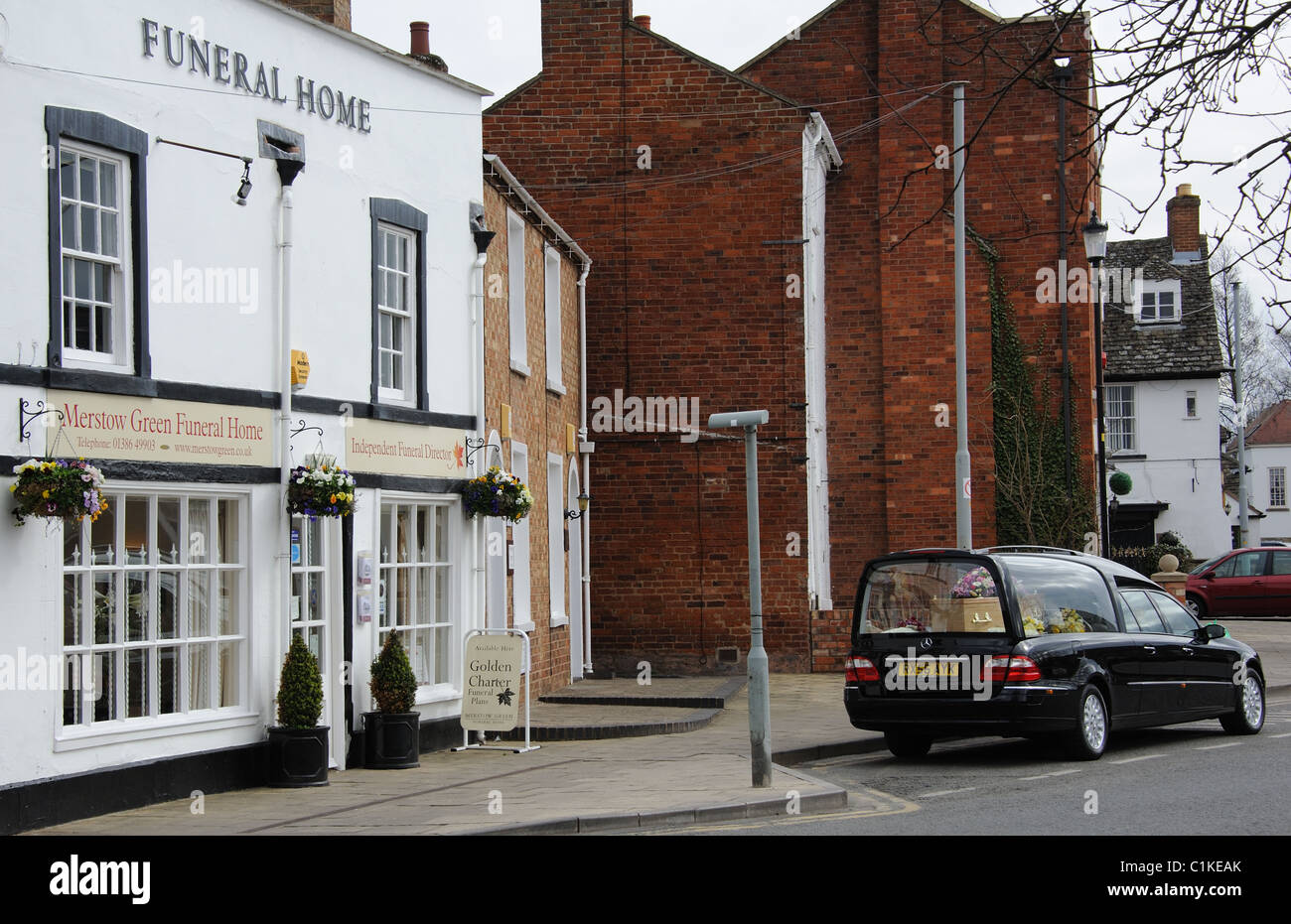 Hearse and coffin outside a funeral home in Worcestershire England Stock Photo