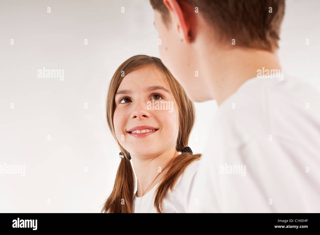 Boy and Girl Looking at Each Other Stock Photo - Alamy