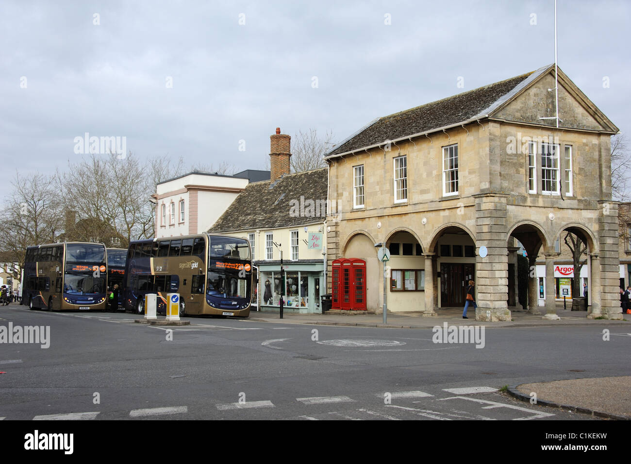 Stagecoach Gold double decker buses outside the historic Town Hall in Witney town centre Oxfordshire England UK Stock Photo