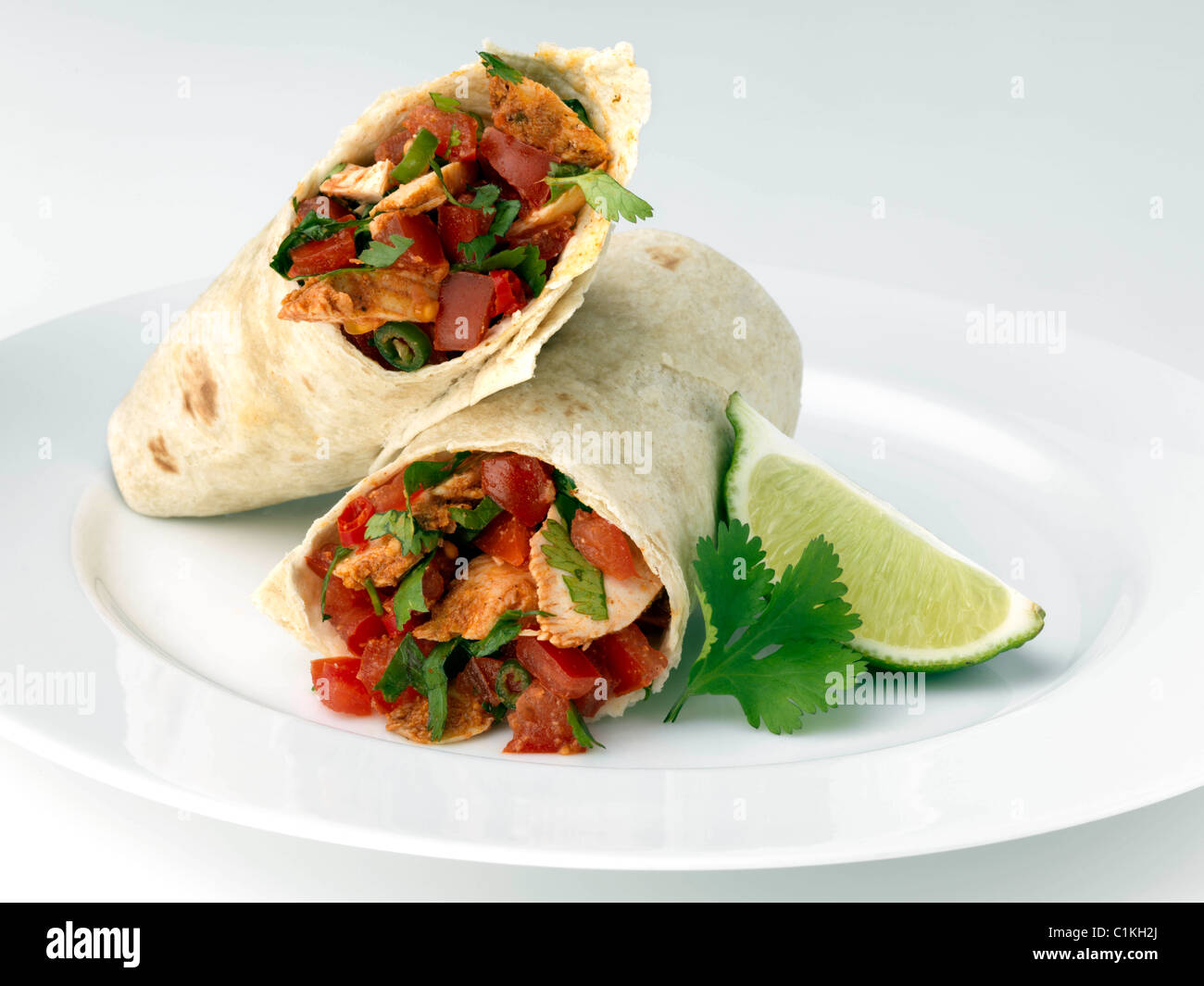 Spicy chicken burrito Mexican main meal Stock Photo