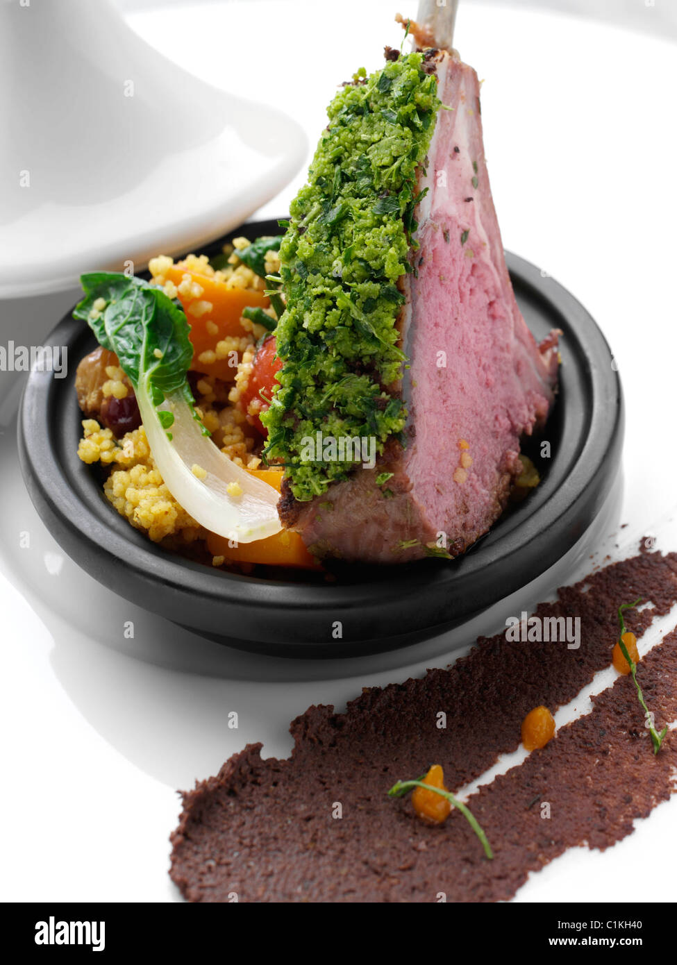Herb crust Morrocan lamb chops with vegetable tagine Stock Photo Alamy