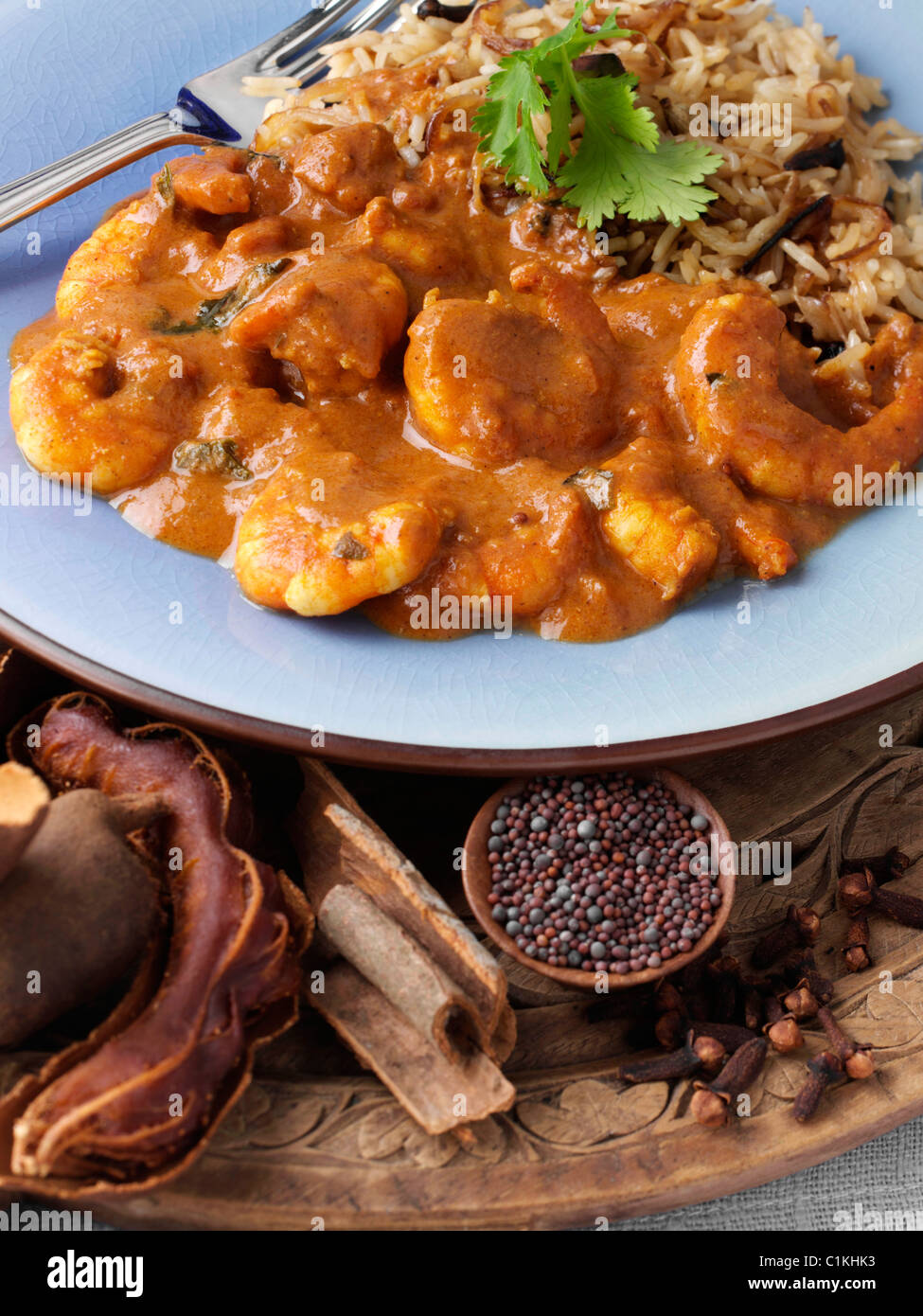 King prawn keralan curry with brown rice Stock Photo Alamy