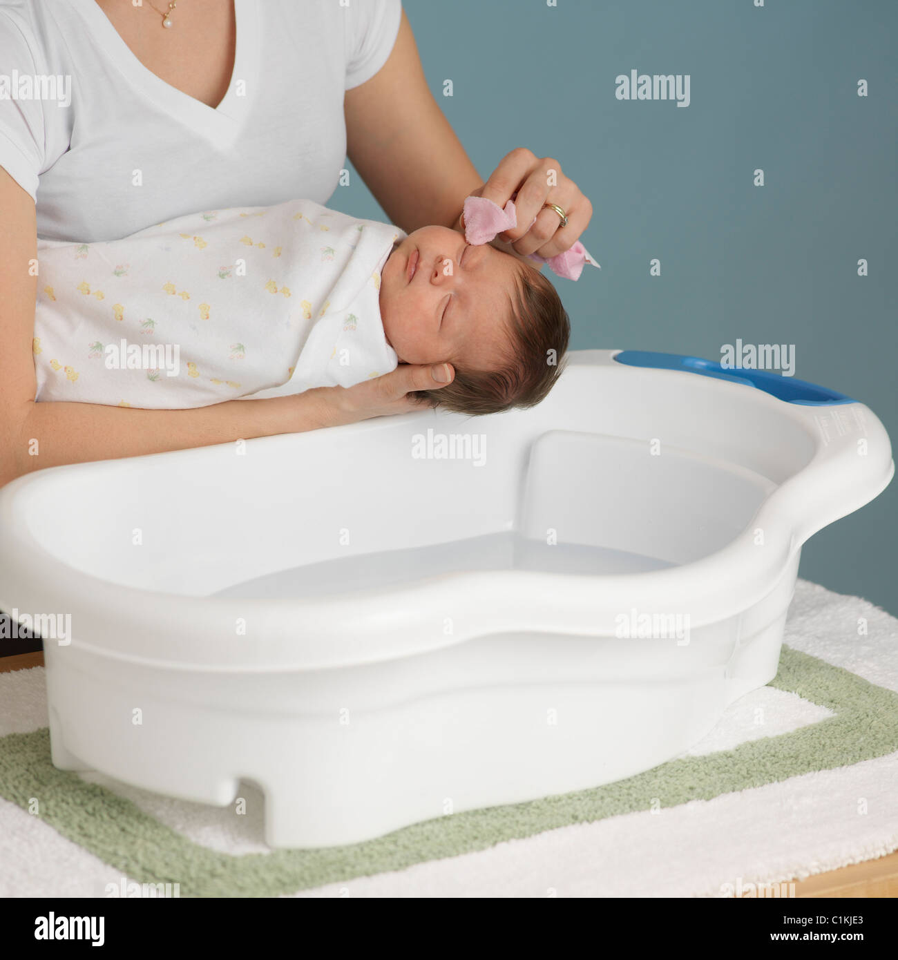 Mother Washing Newborn Baby Stock Photo Alamy