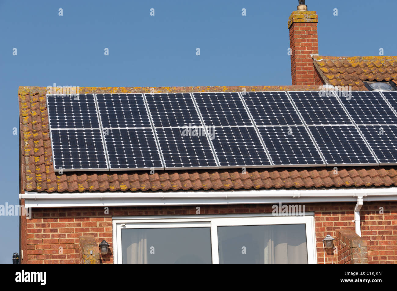 Residential property fitted with solar panels, Essex, UK Stock Photo Alamy