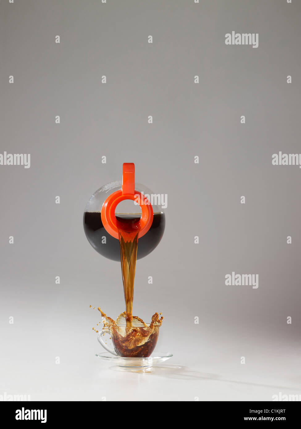 Coffee Pot Pouring Coffee into Cup Stock Photo Alamy
