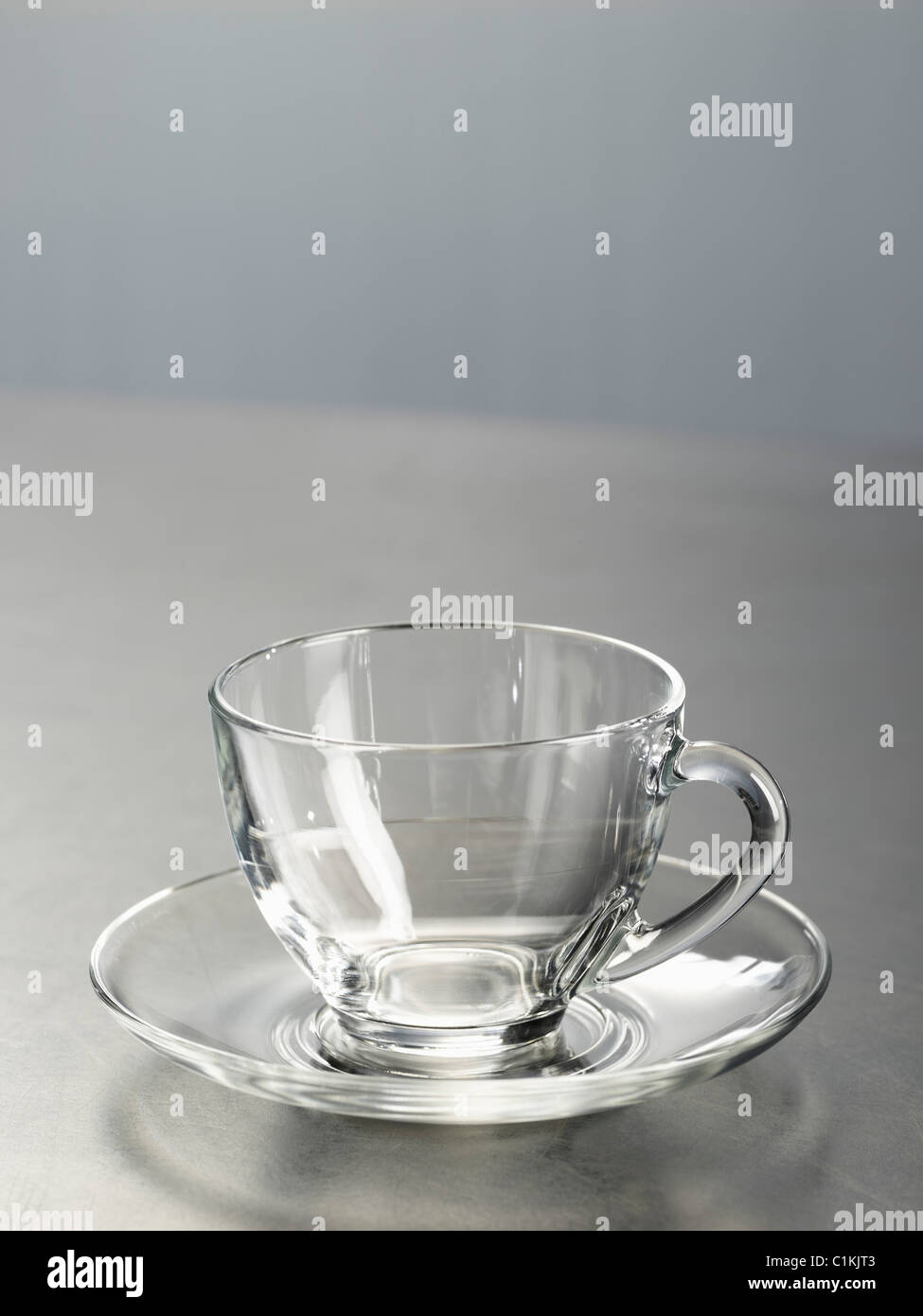 Glass Cup and Saucer Stock Photo Alamy
