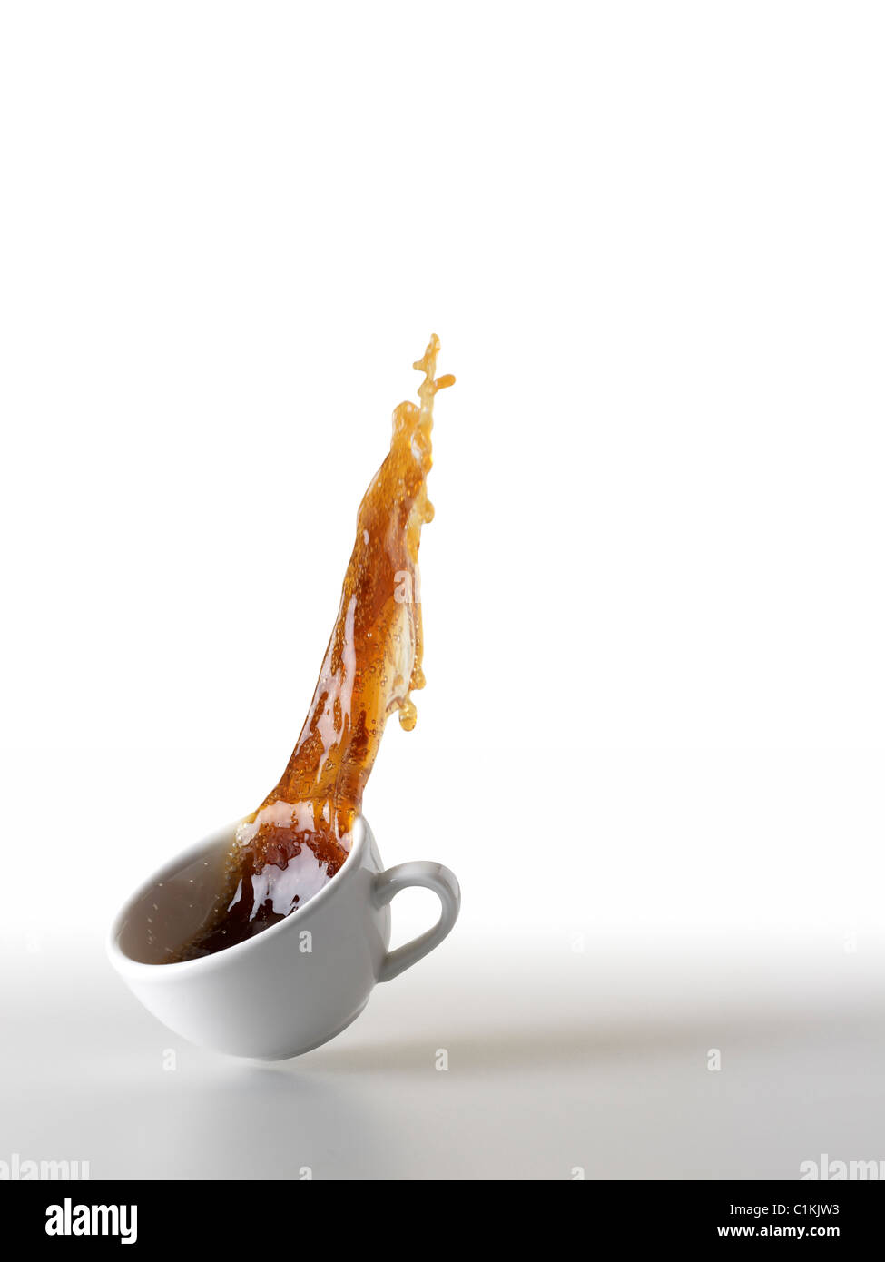 https://c8.alamy.com/comp/C1KJW3/coffee-spilling-out-of-coffee-cup-C1KJW3.jpg