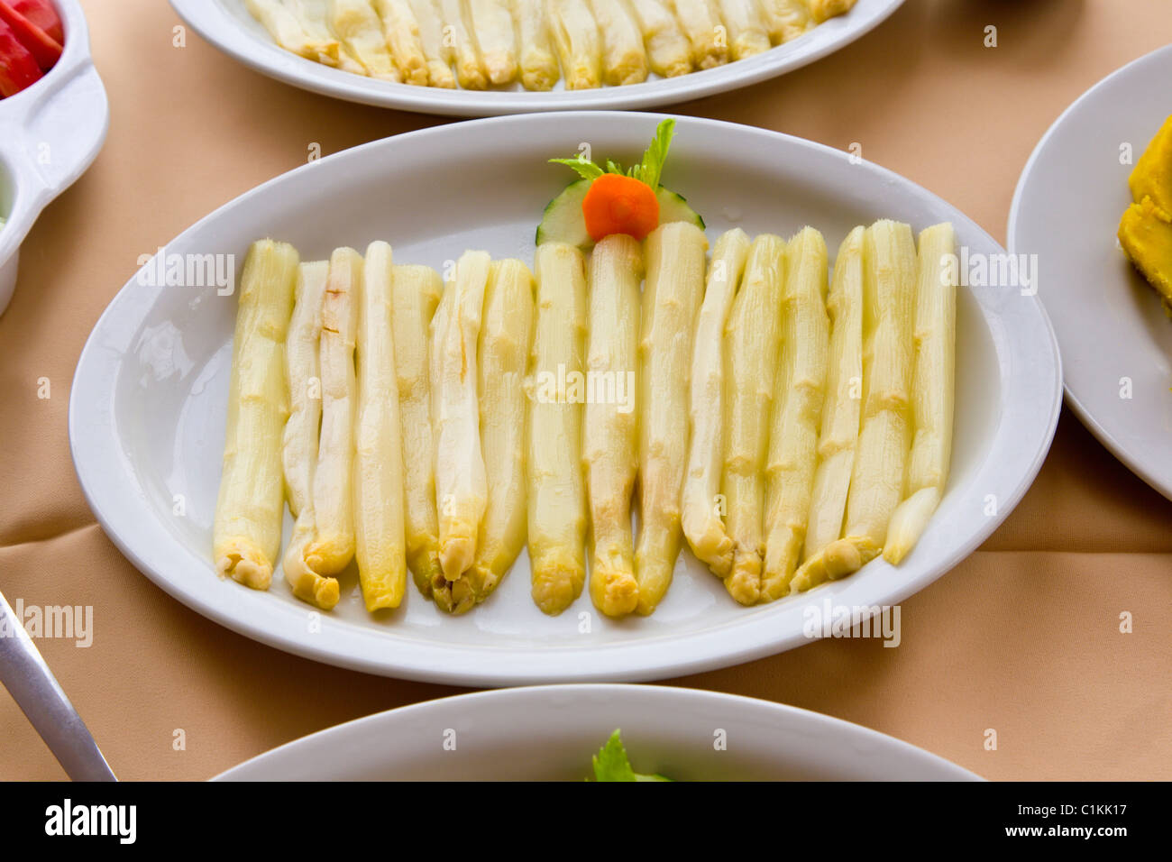 Dish of white asparagus Stock Photo
