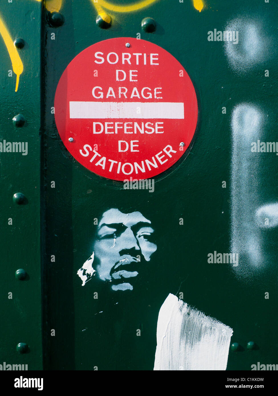 No parking sign and graffitti on garage door, France Stock Photo