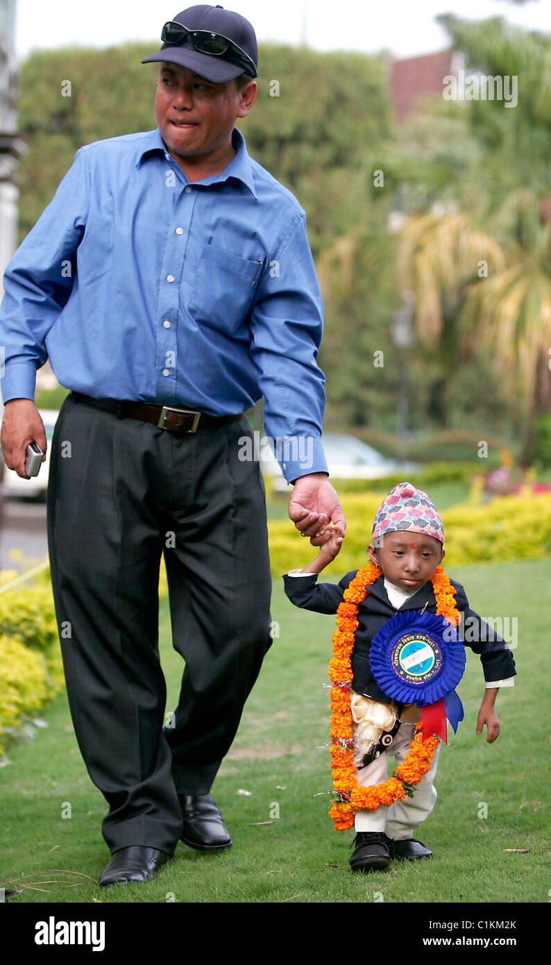 SMALL WONDER Is this the world's smallest man? Tiny Khagendra Thapa Magar, 17, stands just 1.6ft (51cm) tall and weighs in at Stock Photo